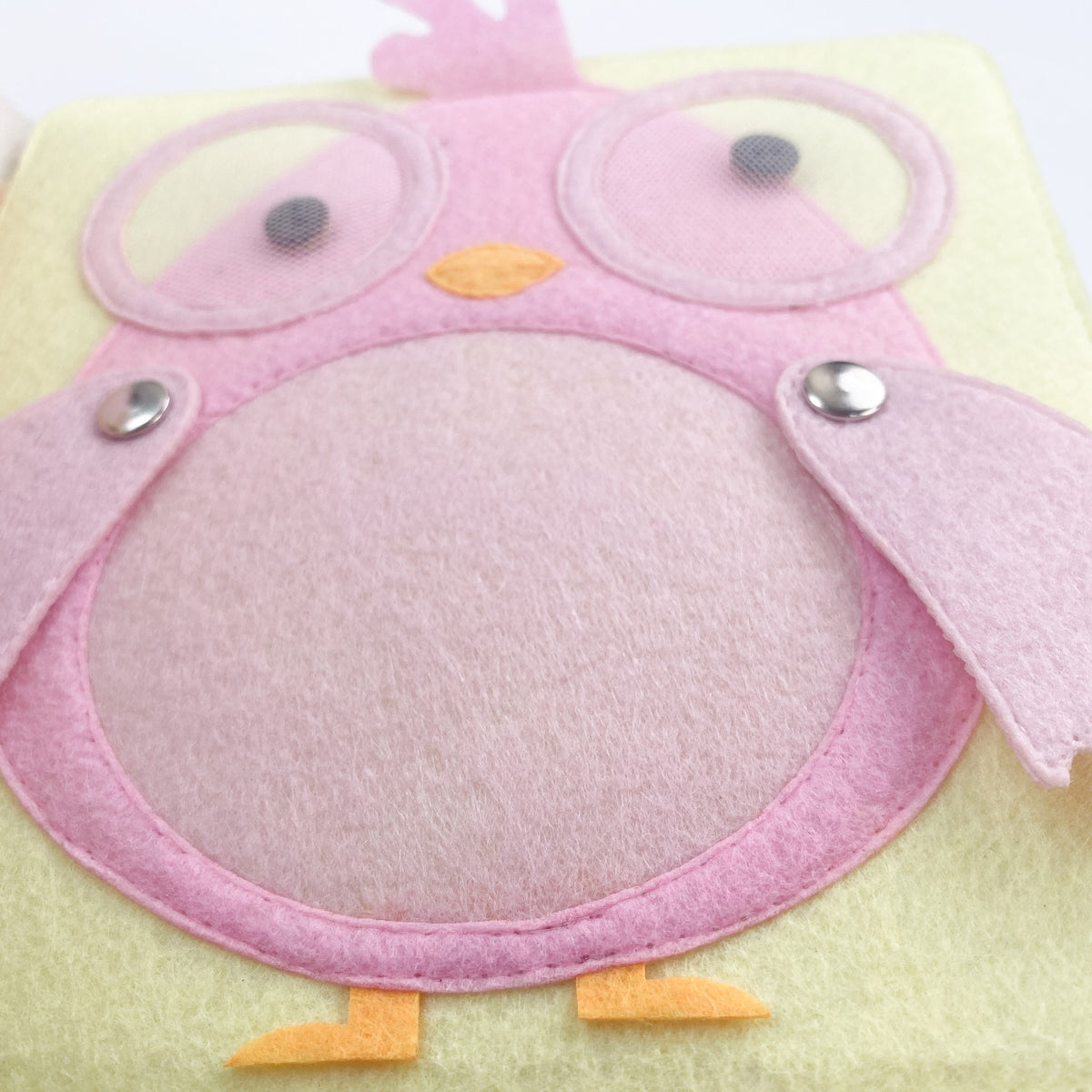 Pink felt owl page with peek-a-boo flaps in a quiet book