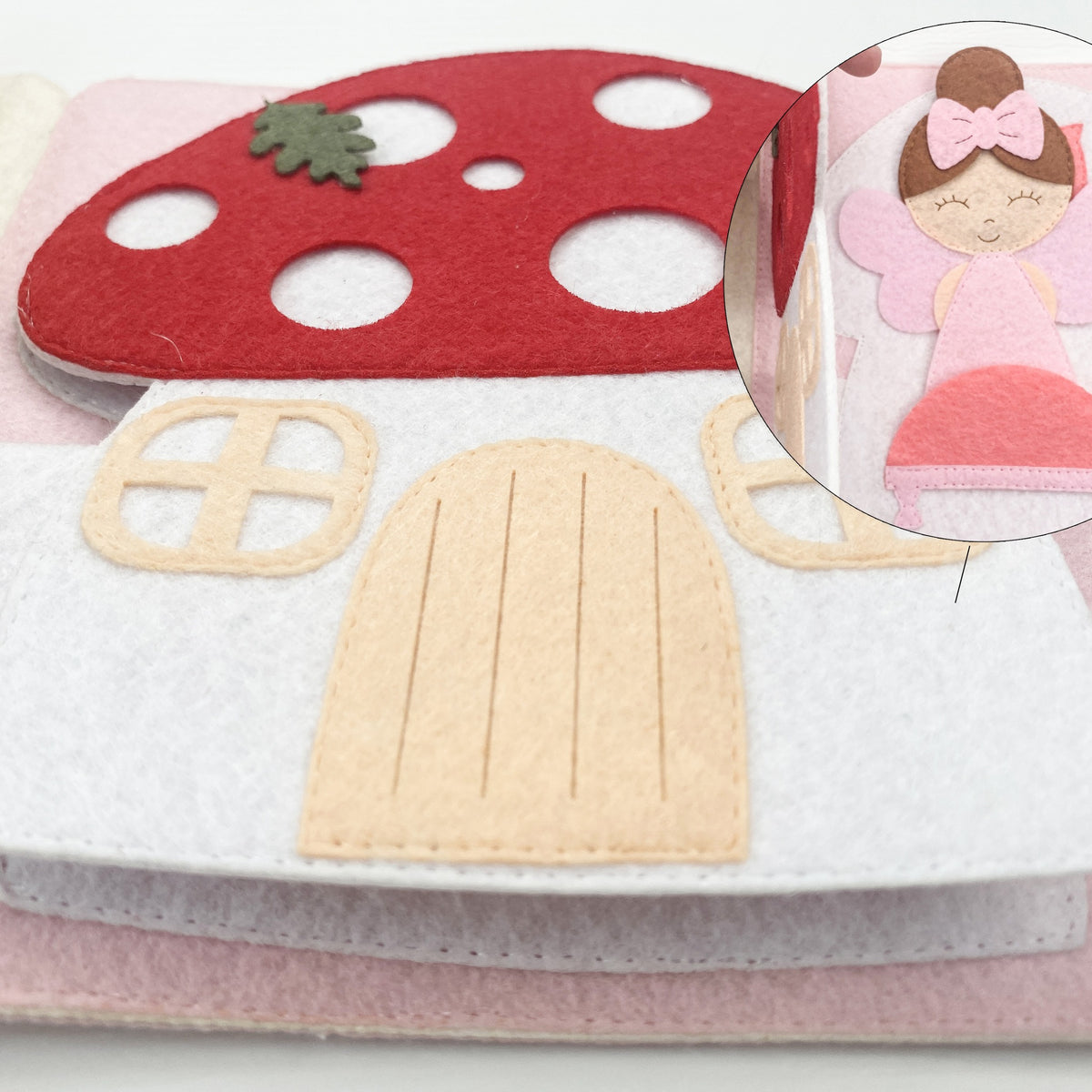 Felt mushroom house page with a door that opens and a hidden fairy