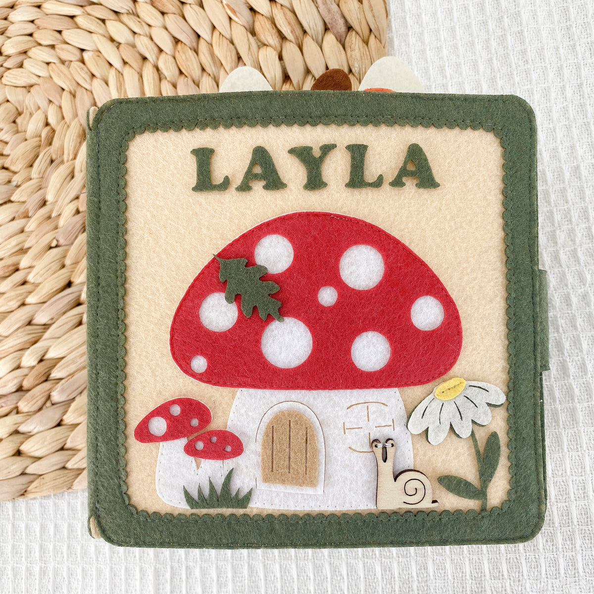 Personalized mushroom felt quiet book with embroidered name Layla, front cover
