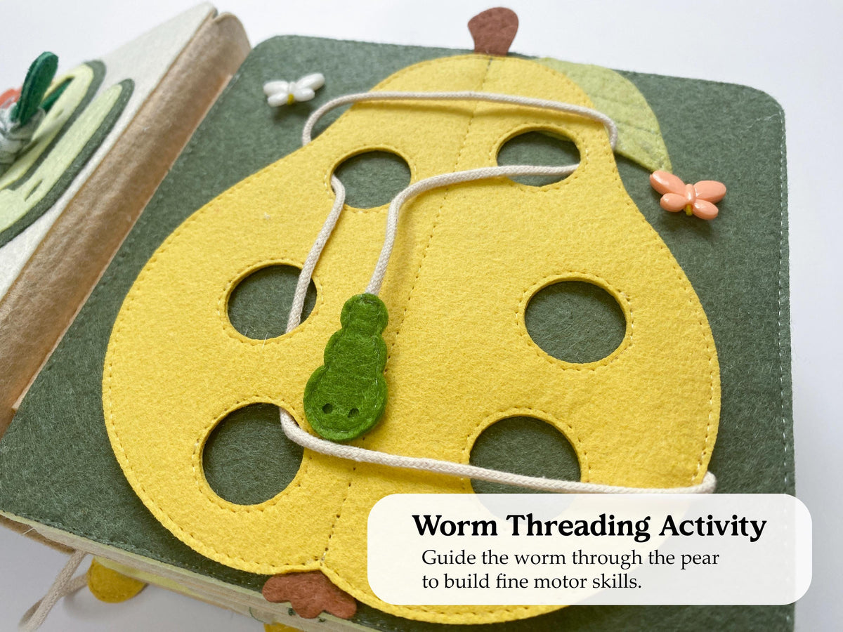 Felt pear threading page with a worm lace in a busy book