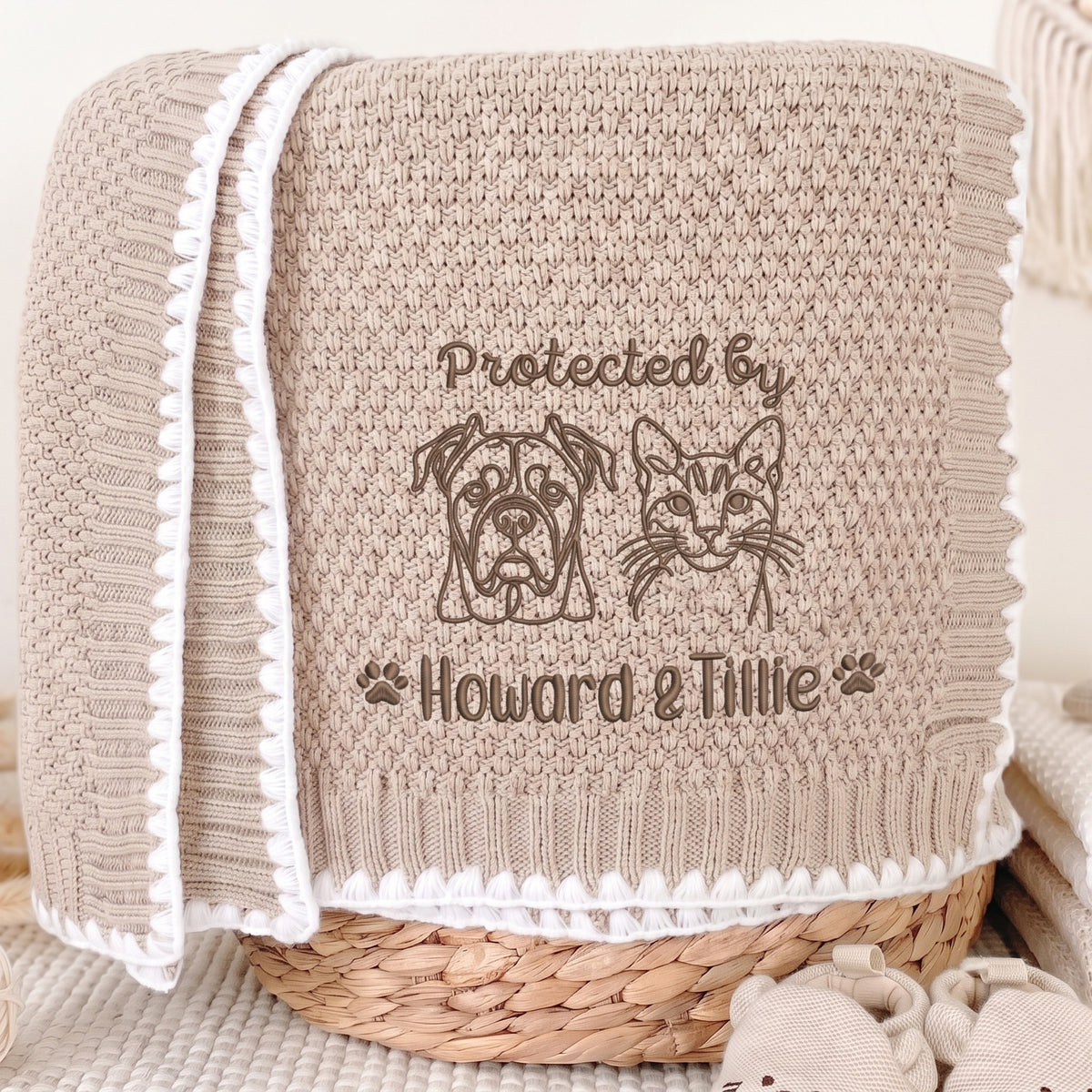 Beige personalized pet portrait baby blanket with brown embroidered dog, cat and pet names