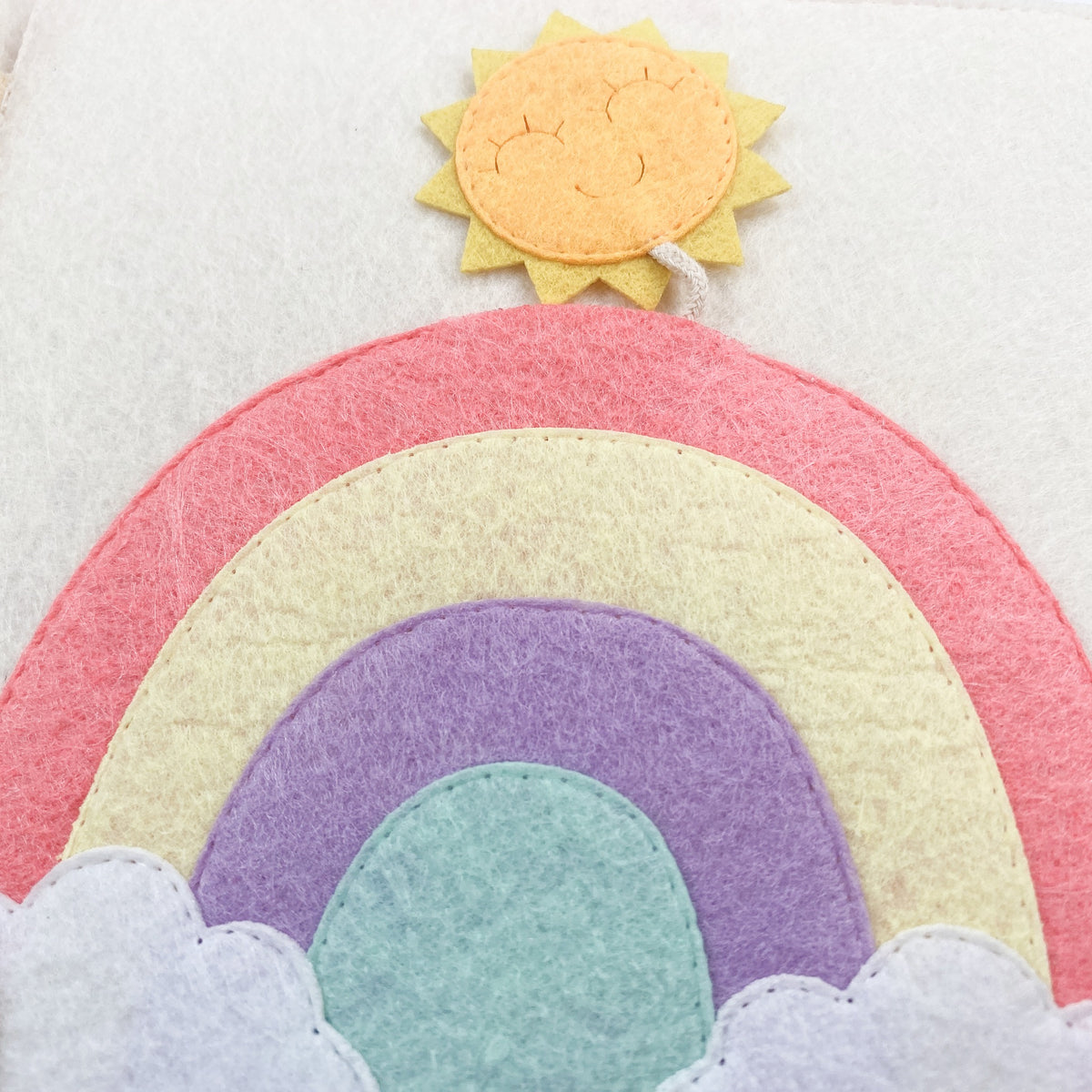 Felt rainbow page with a sun in a strawberry busy book