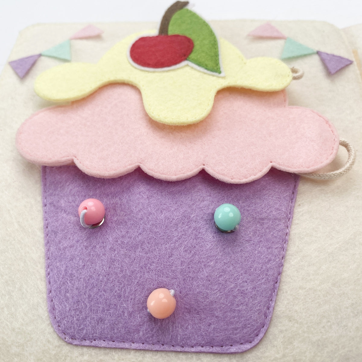 Felt cupcake counting page with beads in a busy book