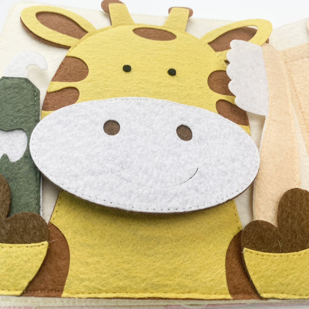Felt giraffe page in the Full version of a strawberry quiet book
