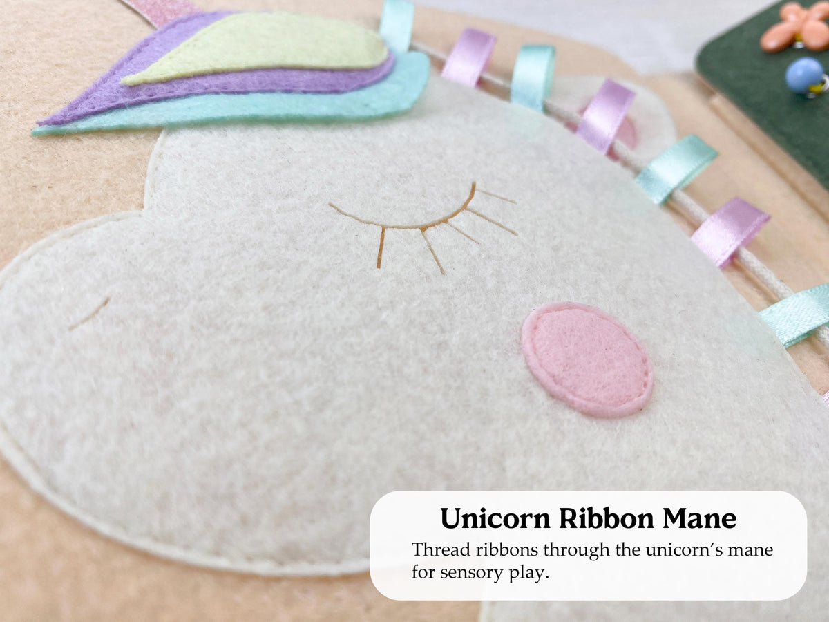 Felt unicorn page with a ribbon mane in a busy book